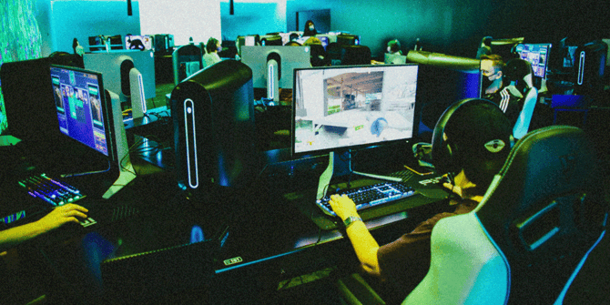People playing games on computers at Fortress