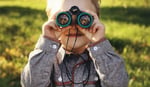 Kid Casting a Bigger Vision with Binoculars