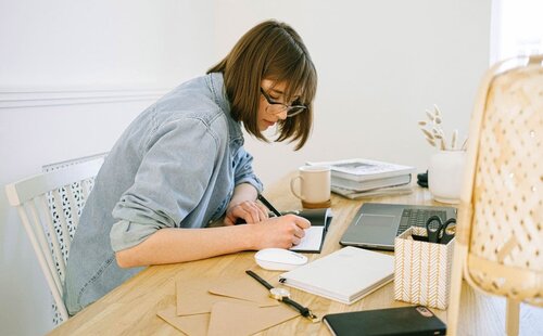 Woman working on her desk