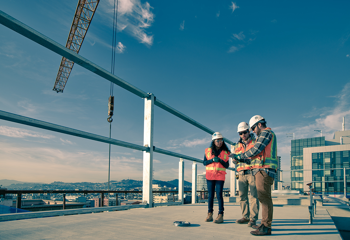 Construction workers on a construction site using Autodesk