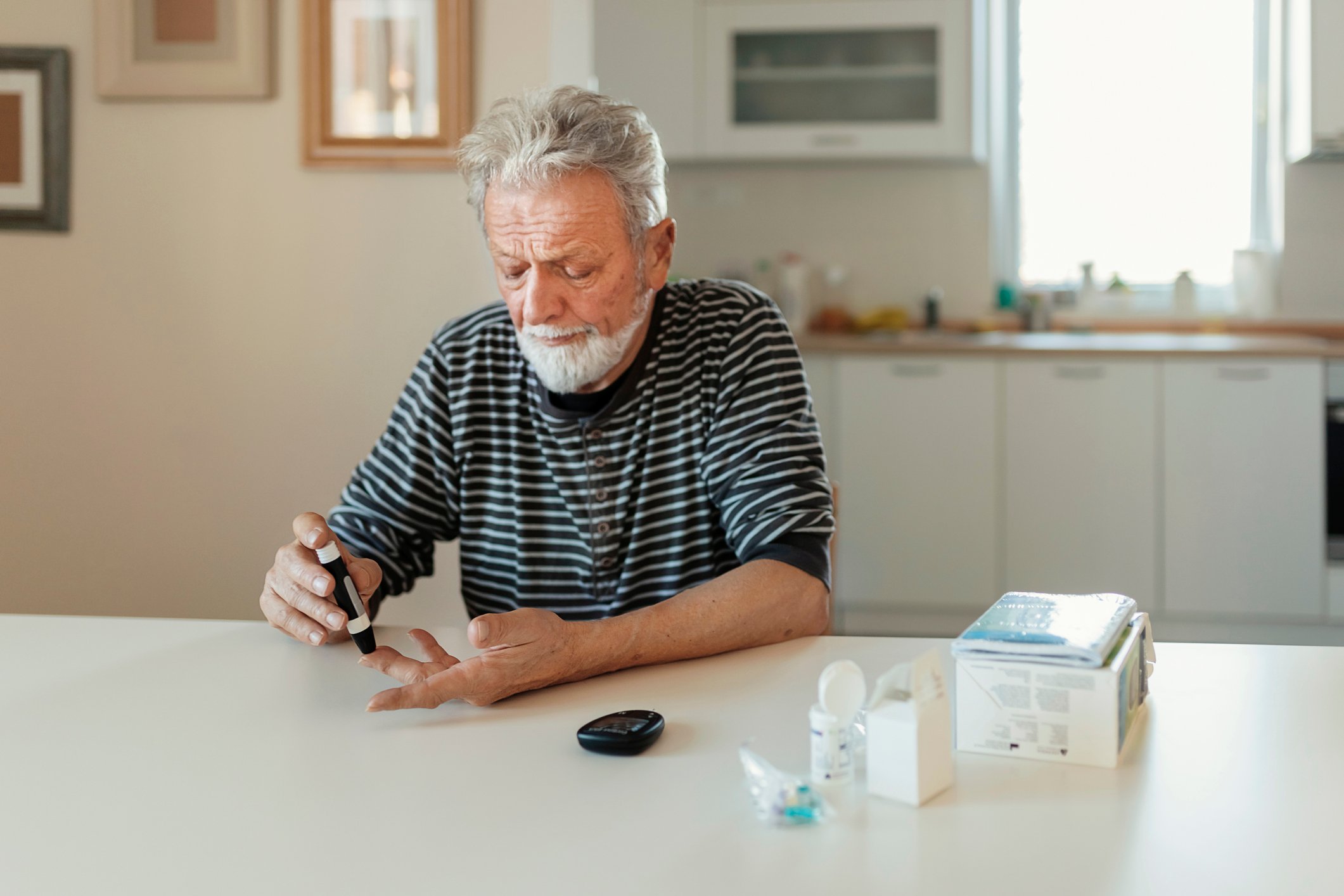 A man testing his blood sugar