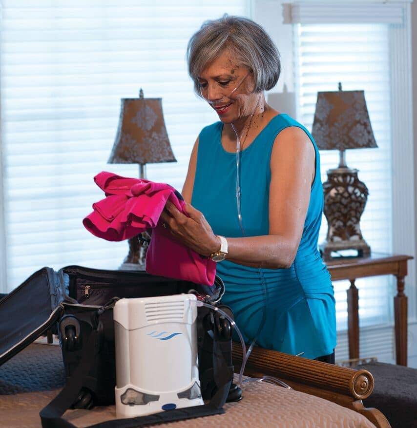 Woman packing bags with the Caire FreeStyle Comfort.