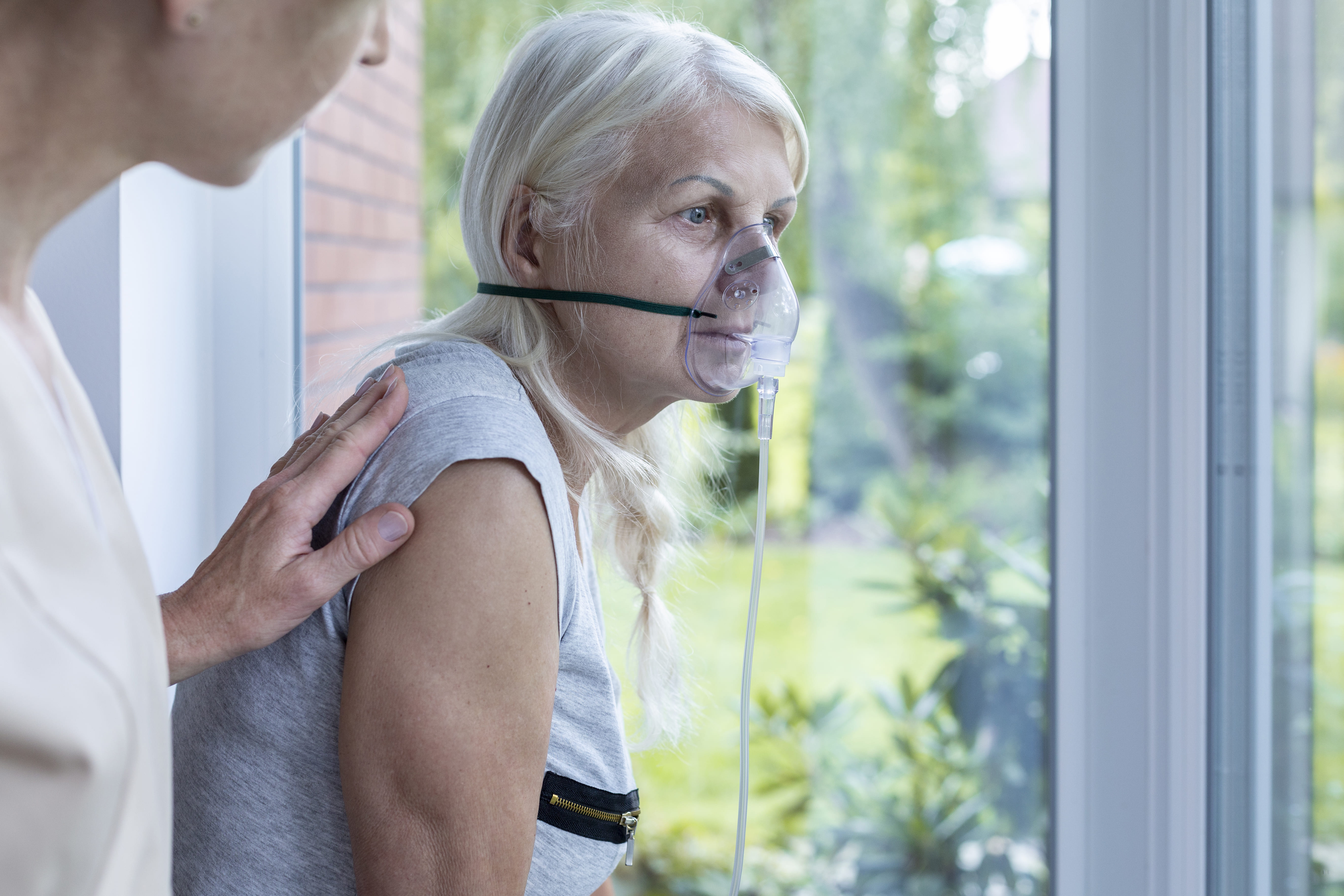 Woman wearing oxygen mask.