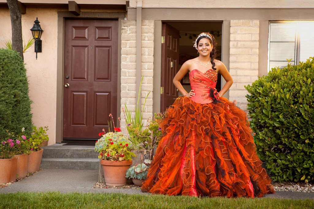 HISPANIC TEENAGER DRESSED FOR QUINCEANERA