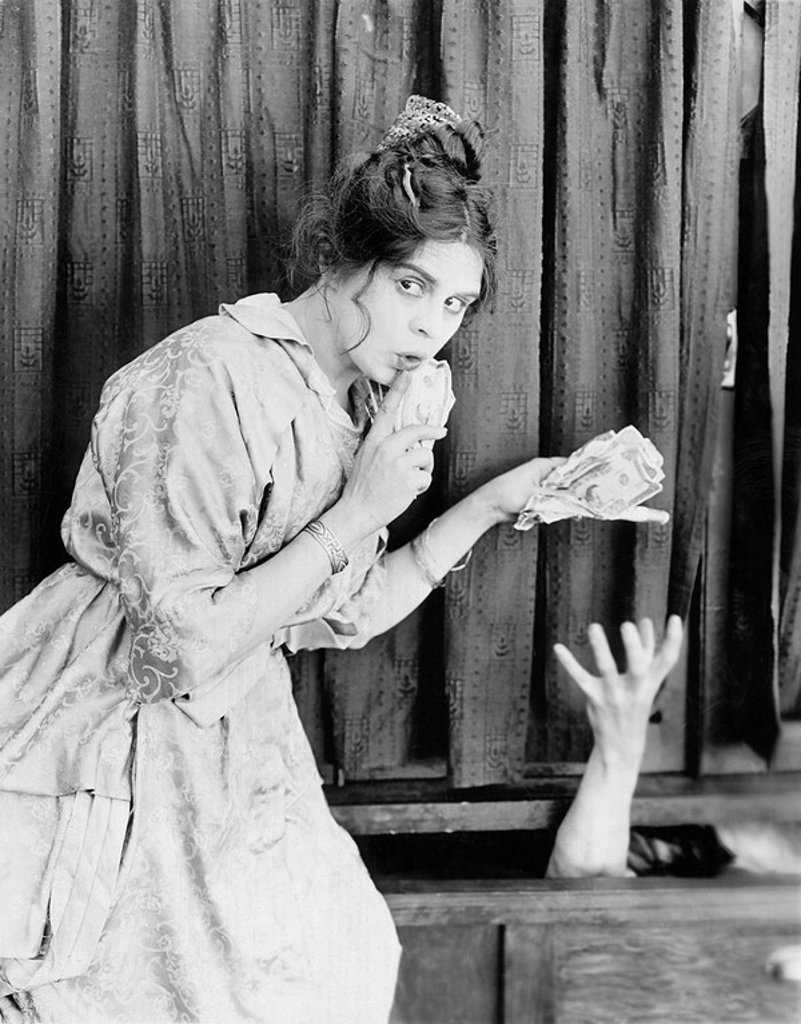 YOUNG WOMAN WITH MONEY IN HER HANDS, GIVING IT TO A SOMEONE