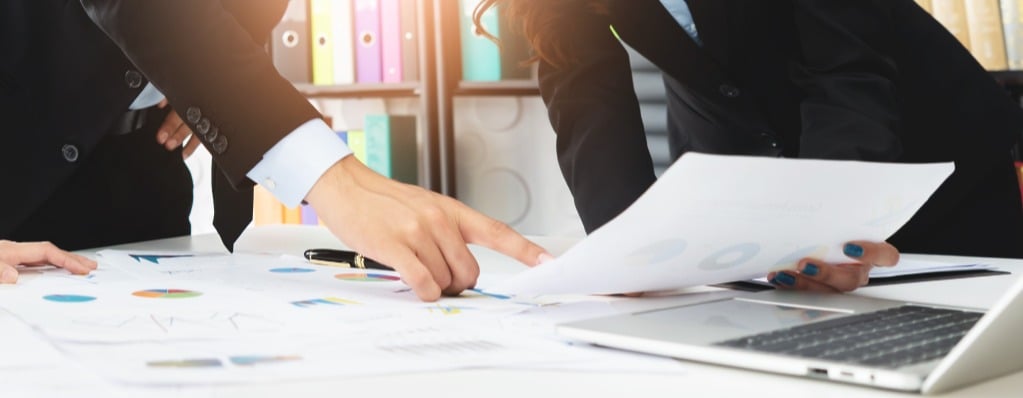 photo of professionals reviewing tax