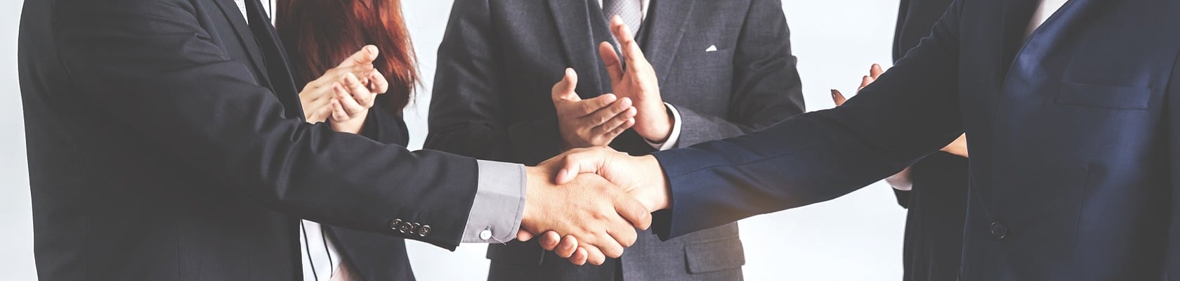 photo of an M&A deal - people shaking hands