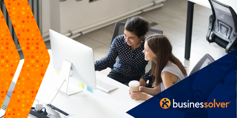 two-women-working-at-a-computer