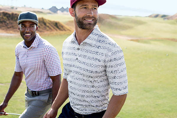 Two Men Golfing wearing Cutter & Buck Polos