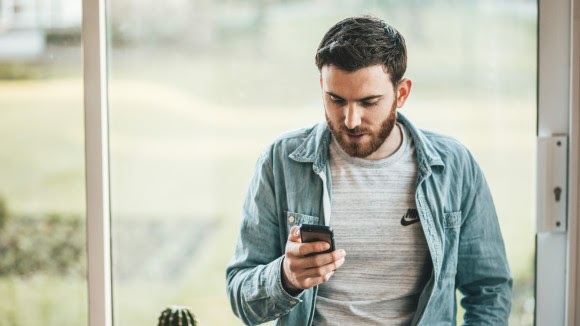 Man using voice search on his phone