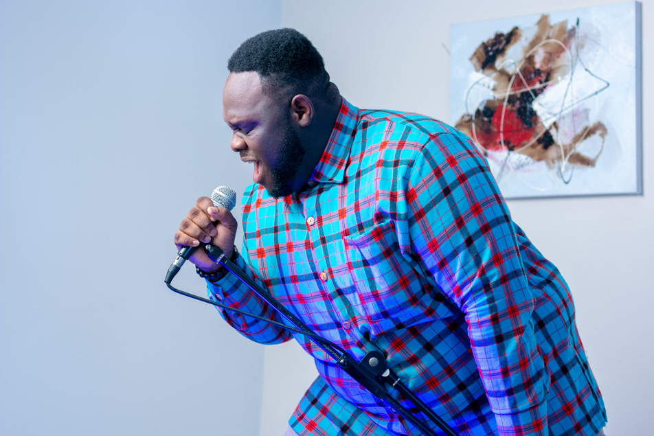 a man singing karaoke as a winter team building activity 