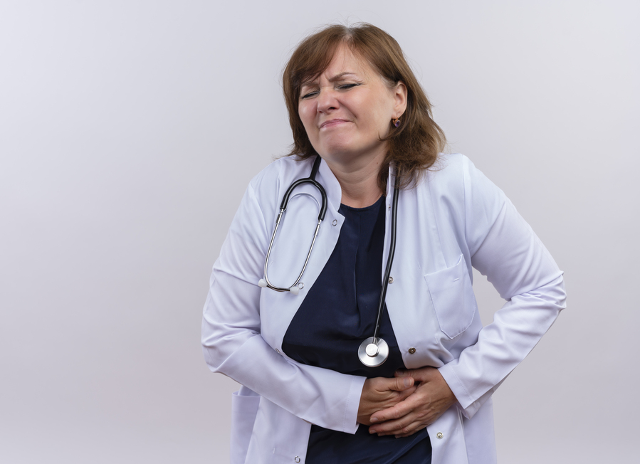 disappointed-middle-aged-woman-doctor-wearing-medical-robe-stethoscope-hands-kidneys-suffering-from-kidney-pain-isolated-white-wall-with-copy-space