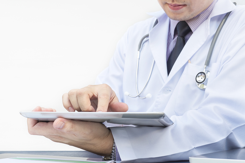 doctor-is-working-with-tablet-white-background