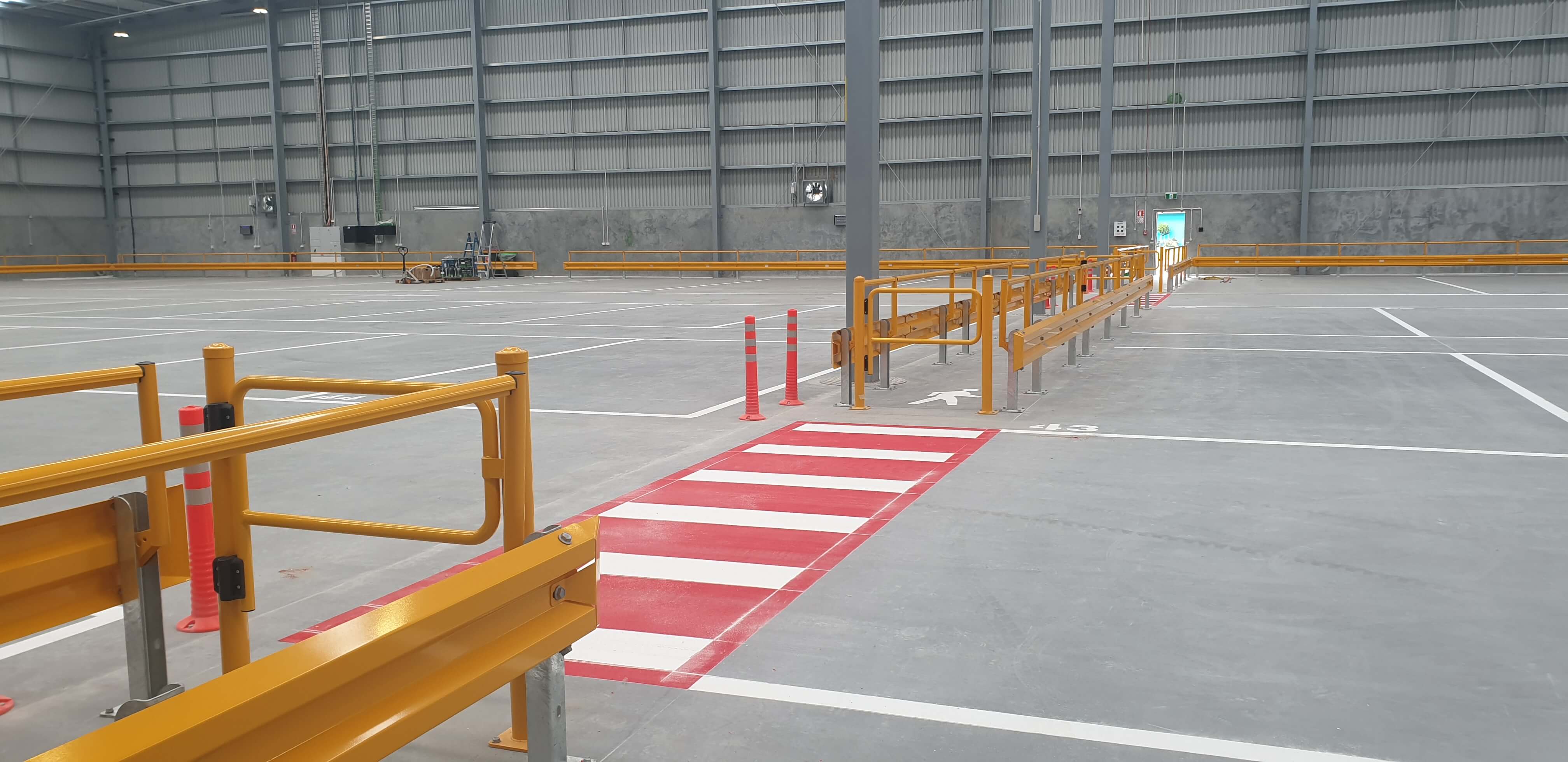 Warehouse pedestrian walkways with barriers