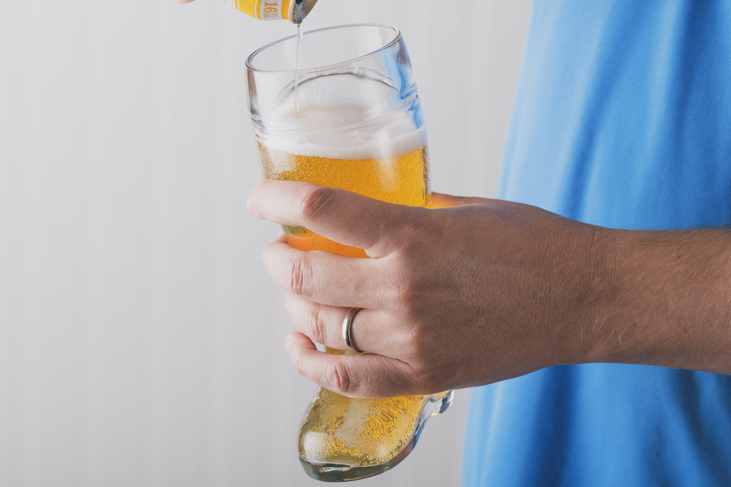 pouring beer into a beer boot