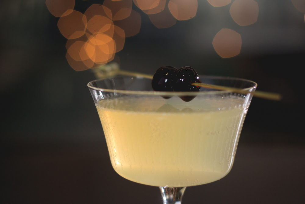 french 75 variation with rum,  luxardo, grapefruit