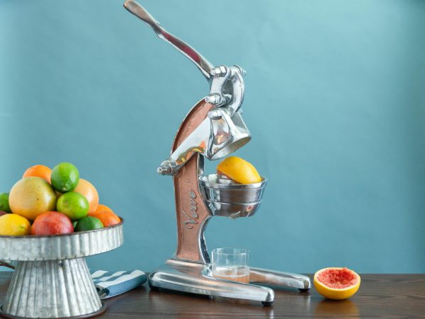 Manual juicer juicing a grapefruit