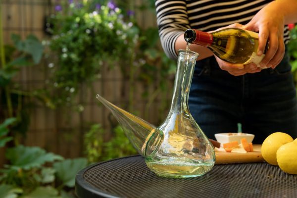 Pouring wine into a porron