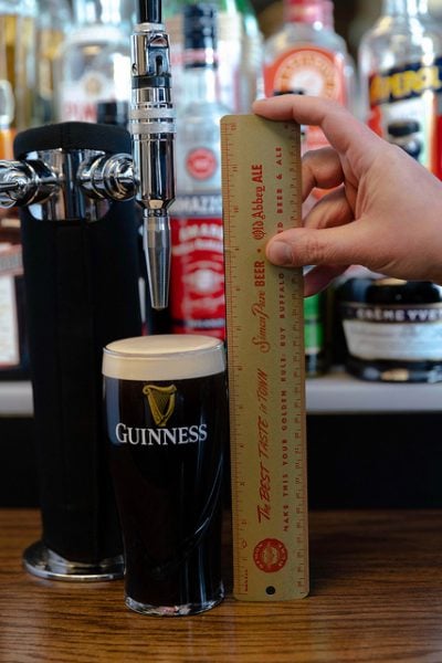 The amount of foamy head from the tried-and-true, proper way to pour a Guinness, measured in at 11/16” exactly.