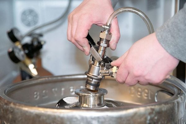 A TOF U-system keg coupler, which is required for pouring Guinness on tap.