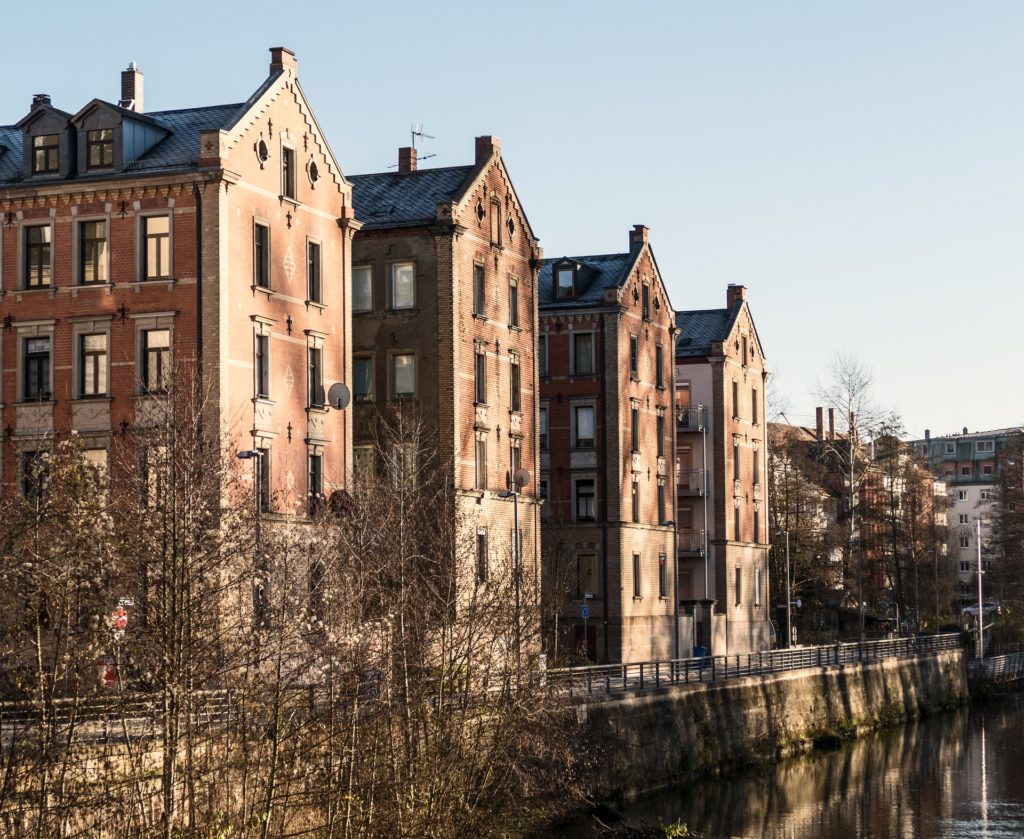 4 apartment buildings standing alongside a river in Fürth