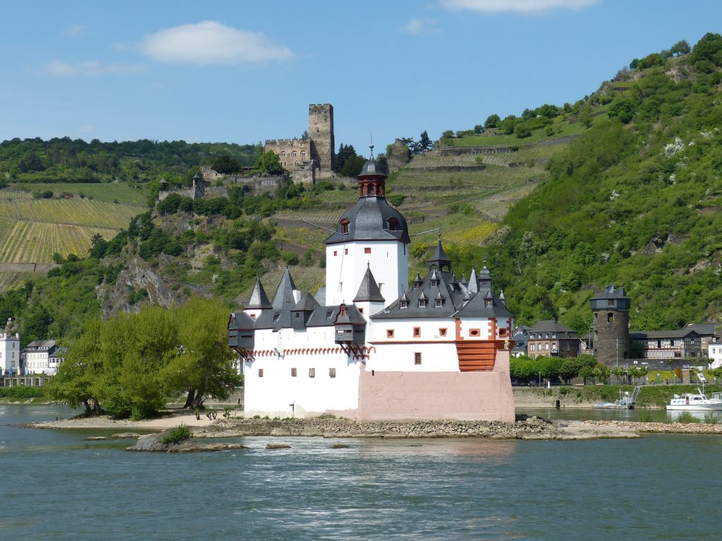 a shot of a church in Pfalzgrafenstein by a lake 