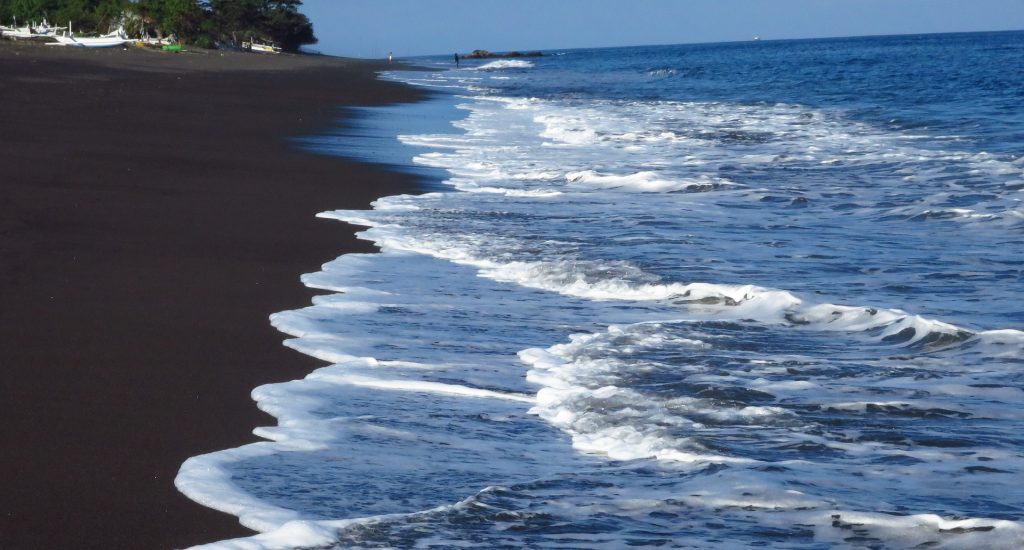 Insider tip in Bali is to visit the volcanic black beaches.