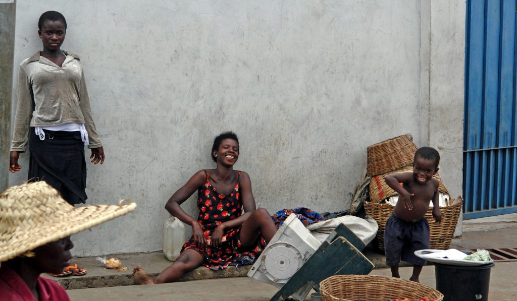 An insider tip is to check out Accra in Ghana with 2 woman and a child smiling.