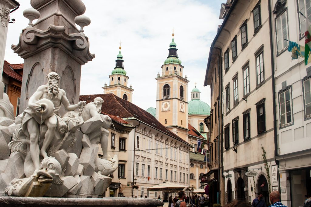 The stunning old town with a beautiful old font in one of the cheapest New Year destinations Ljubljana