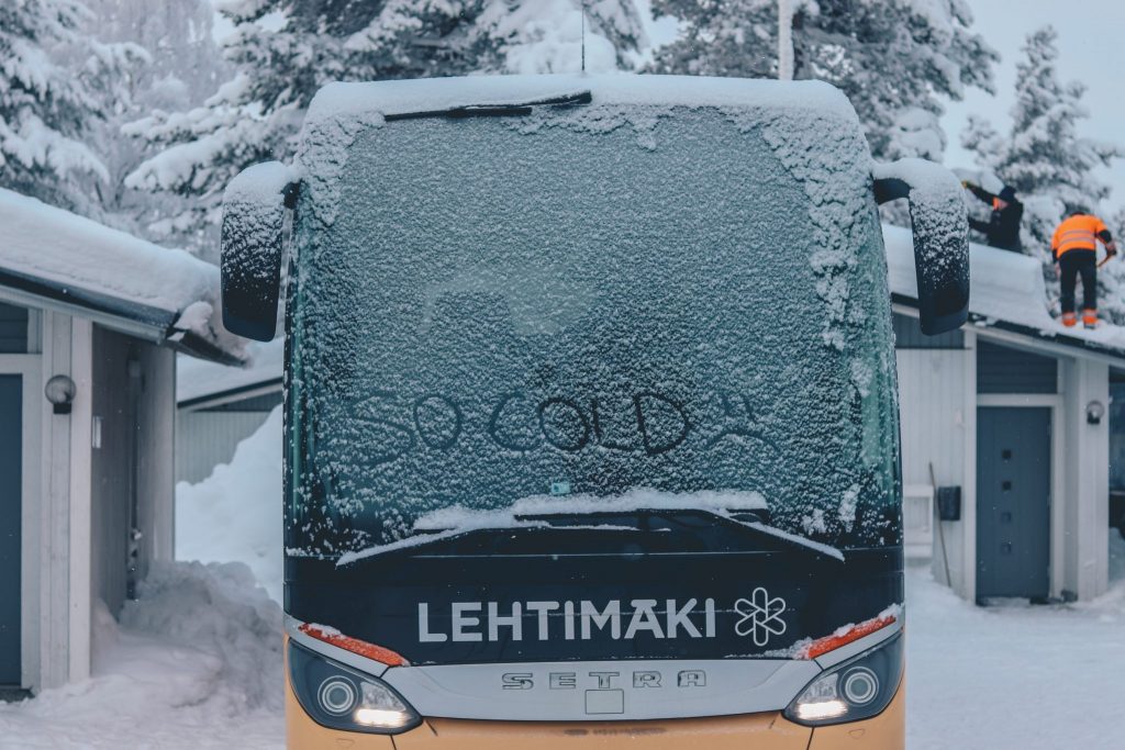 A bus in Finland with a frozen window.