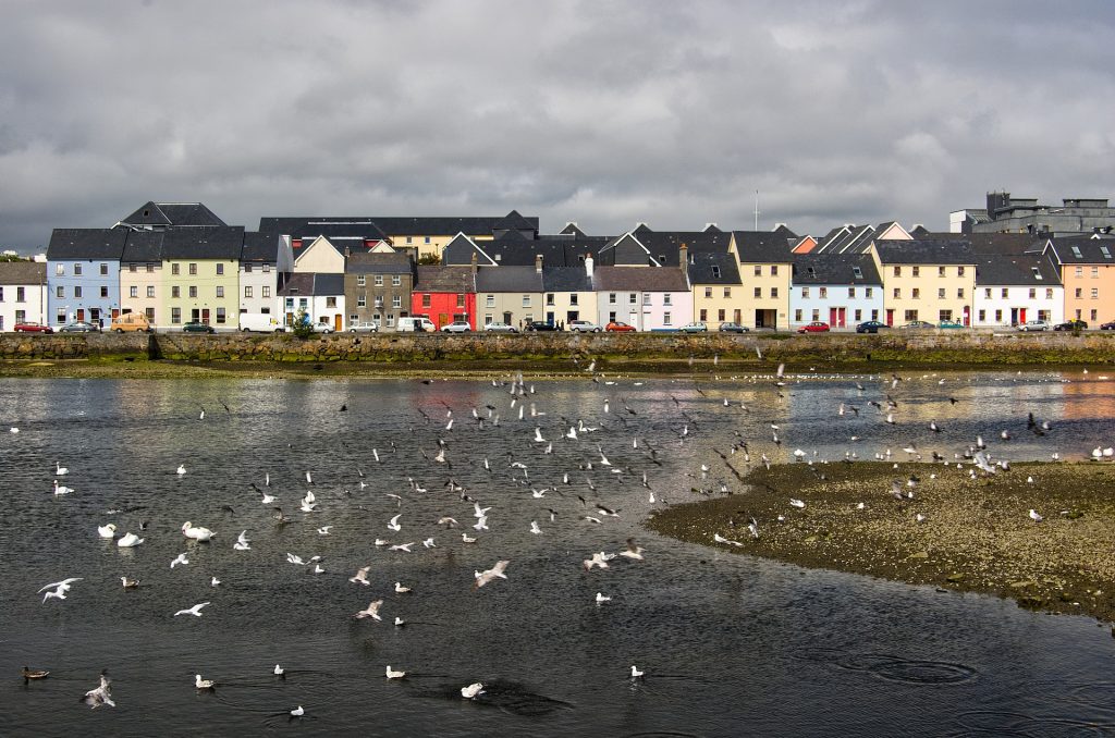 Galway, Ireland with colourful houses in the distance.