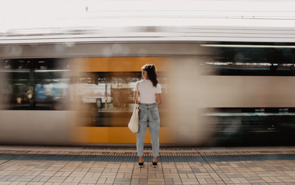 Girl in front of moving train
