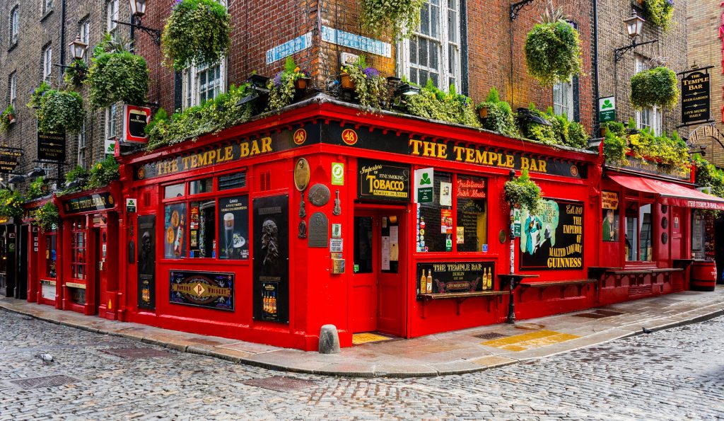 A red pub at the corner of a street in Dublin
