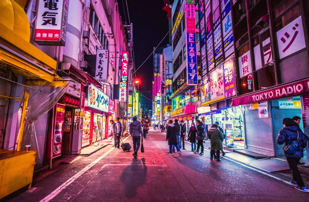 Akihabara an escape to Japan travel itinerary during the evening with pink neon lights.
