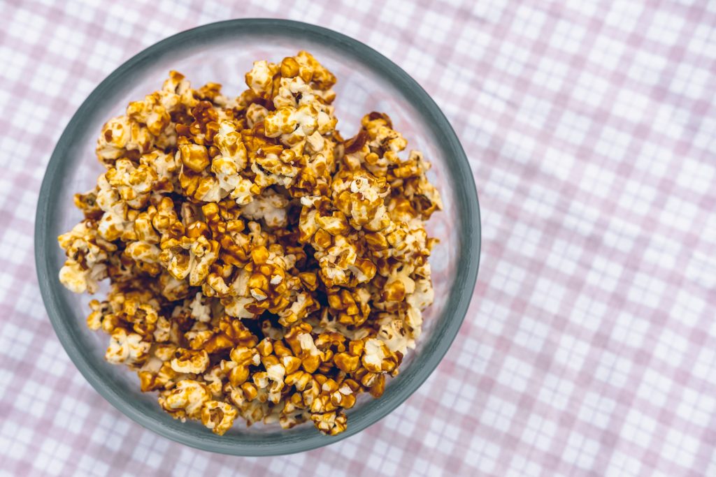 An insider tip for Chicago is to try their caramelised popcorn on a pink cloth table.