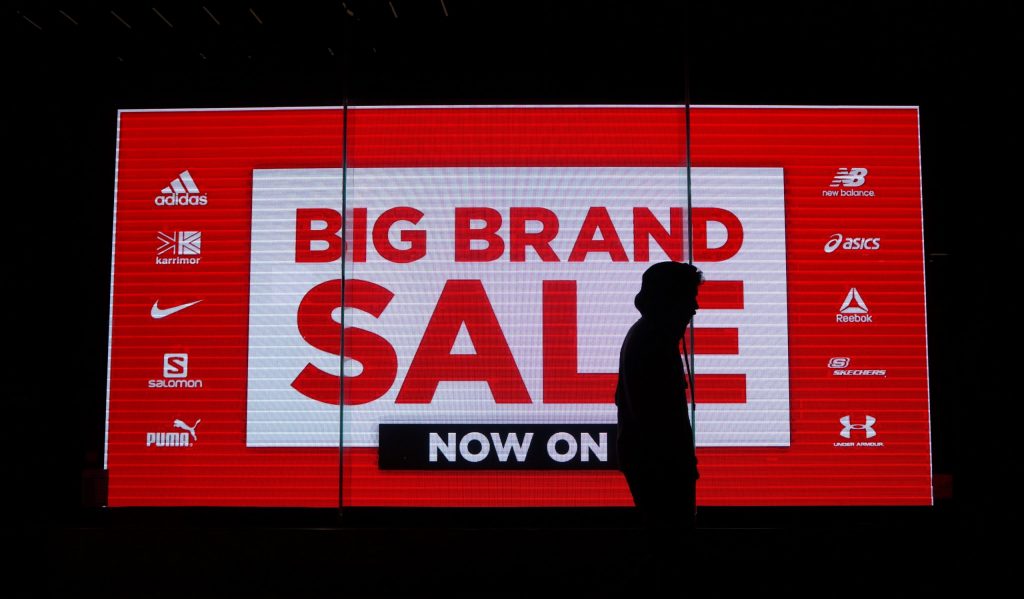 Big brand sale now on text on a tv screen during Black Friday 