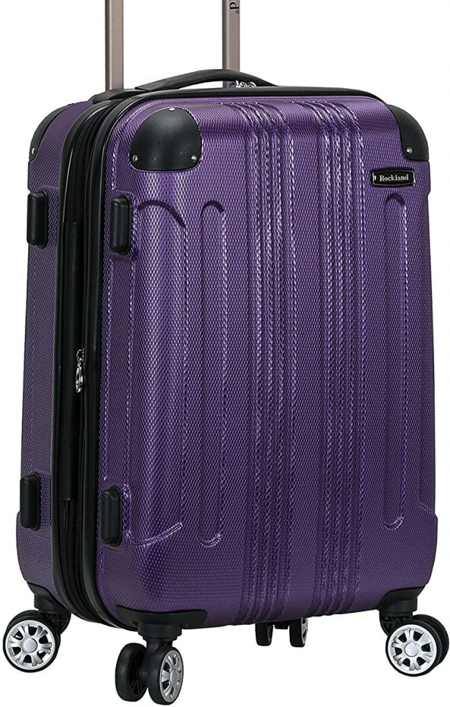 Ein lila Handgepäckskoffer