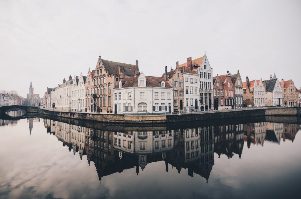 A view of Brugges in Belgium with buildings by the water.