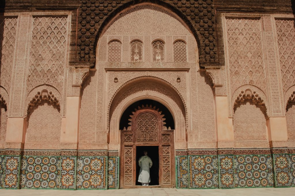 a man standing inside a building door in Marrakesh