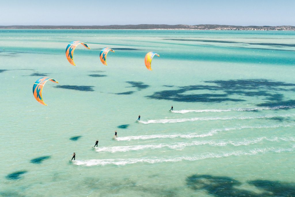 Langebaan Lagune in South Africa, kitesurfers on their boards in the sea