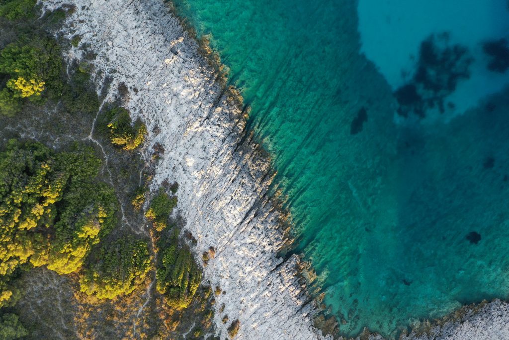 Bird's-eye view of the sea meeting the sand in Croatia.