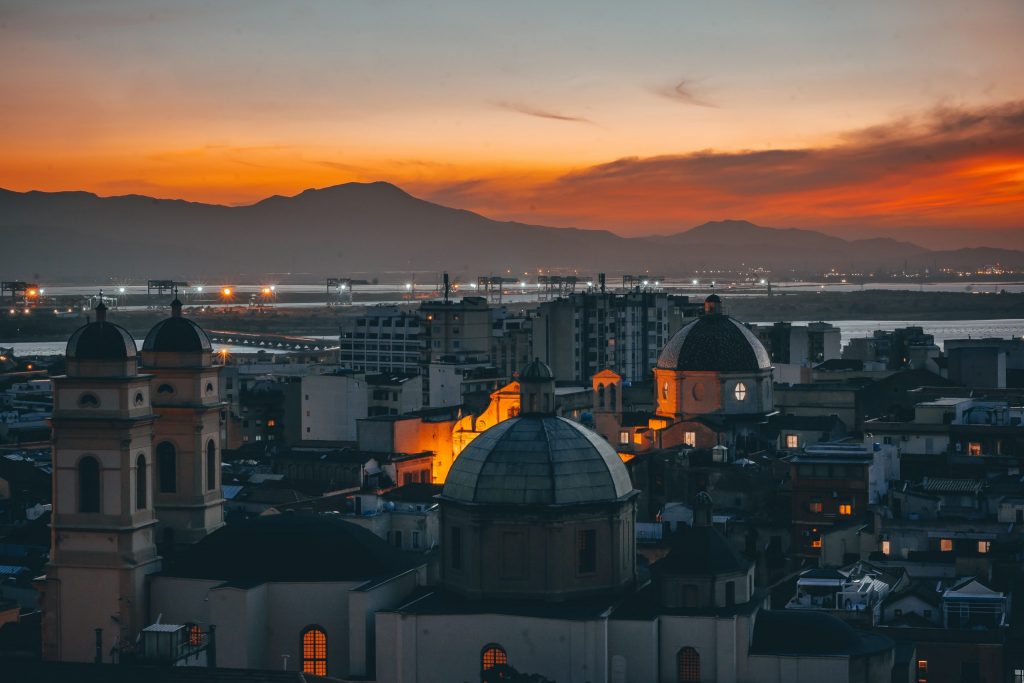 Girls trips to Sardinia: beautiful sunset over the city of Cagliari