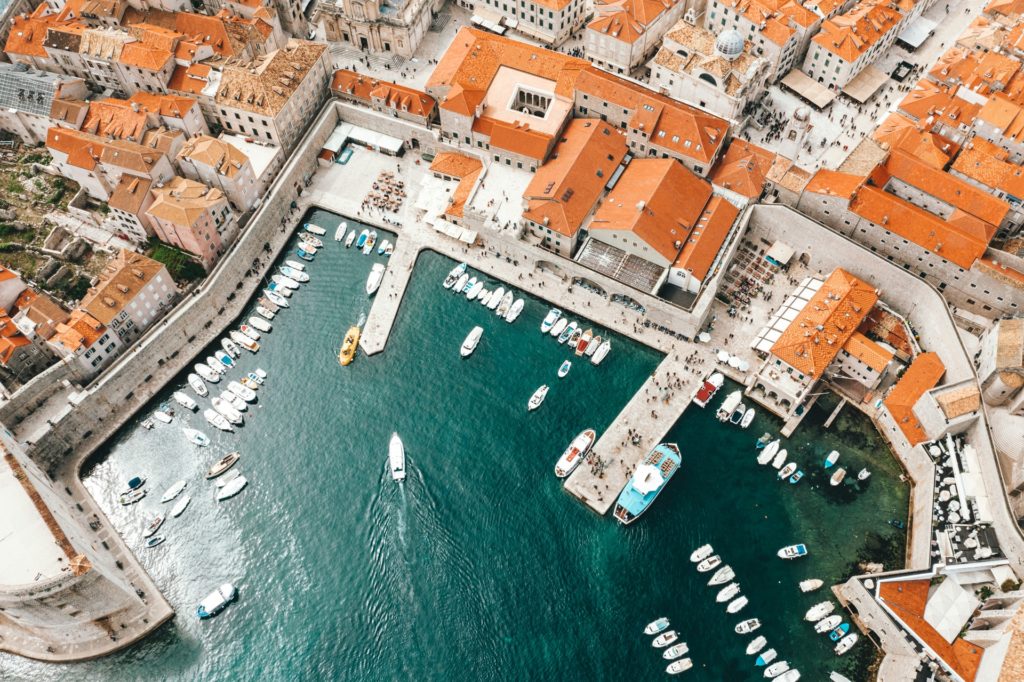 Top 10 cities to visit in Dubrovnik surrounded by sea and orange roof buildings