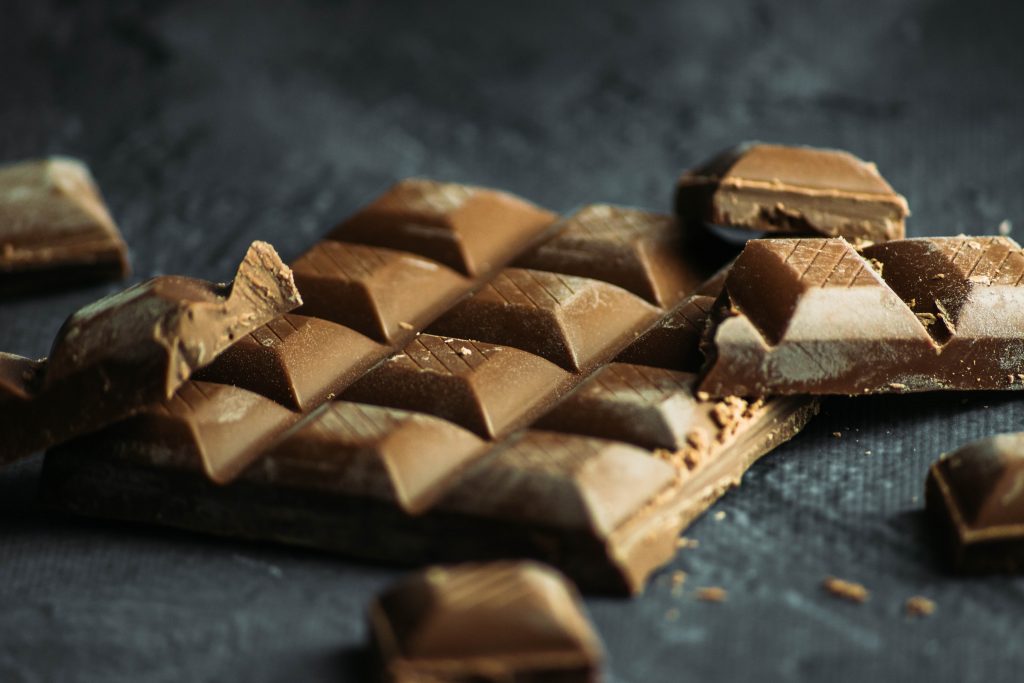 Insider tips for Iceland to try the world's best milk chocolate that is laying on a black table.