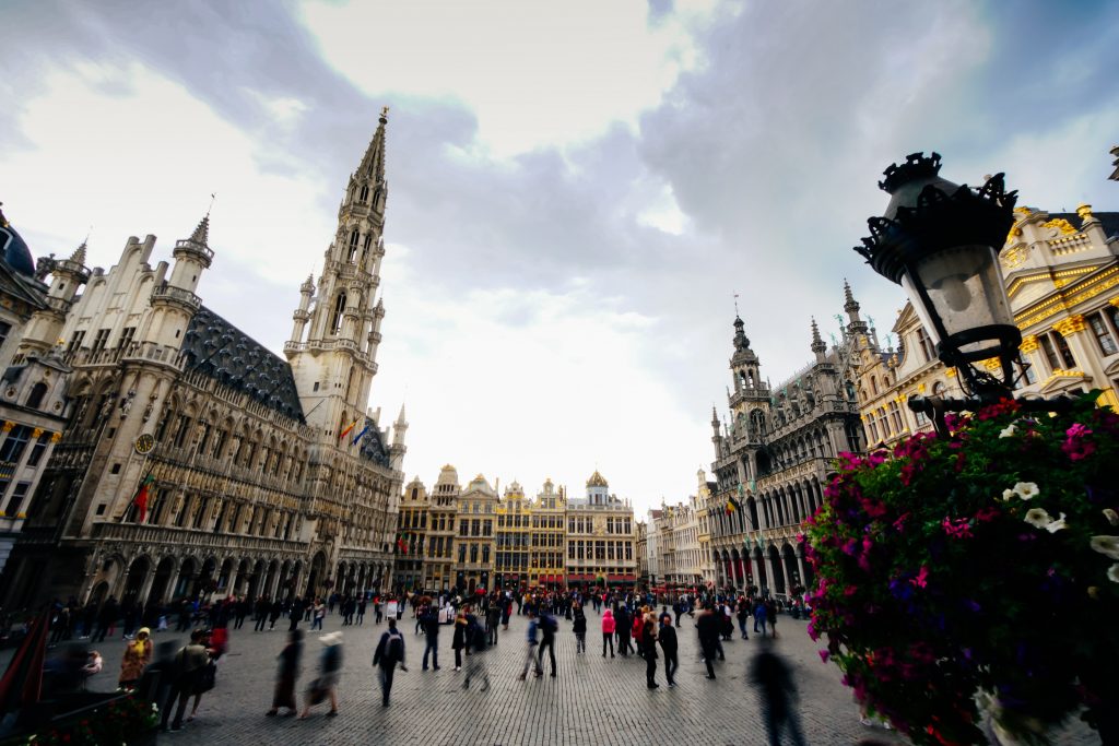 A city view of Belgium with people walking.