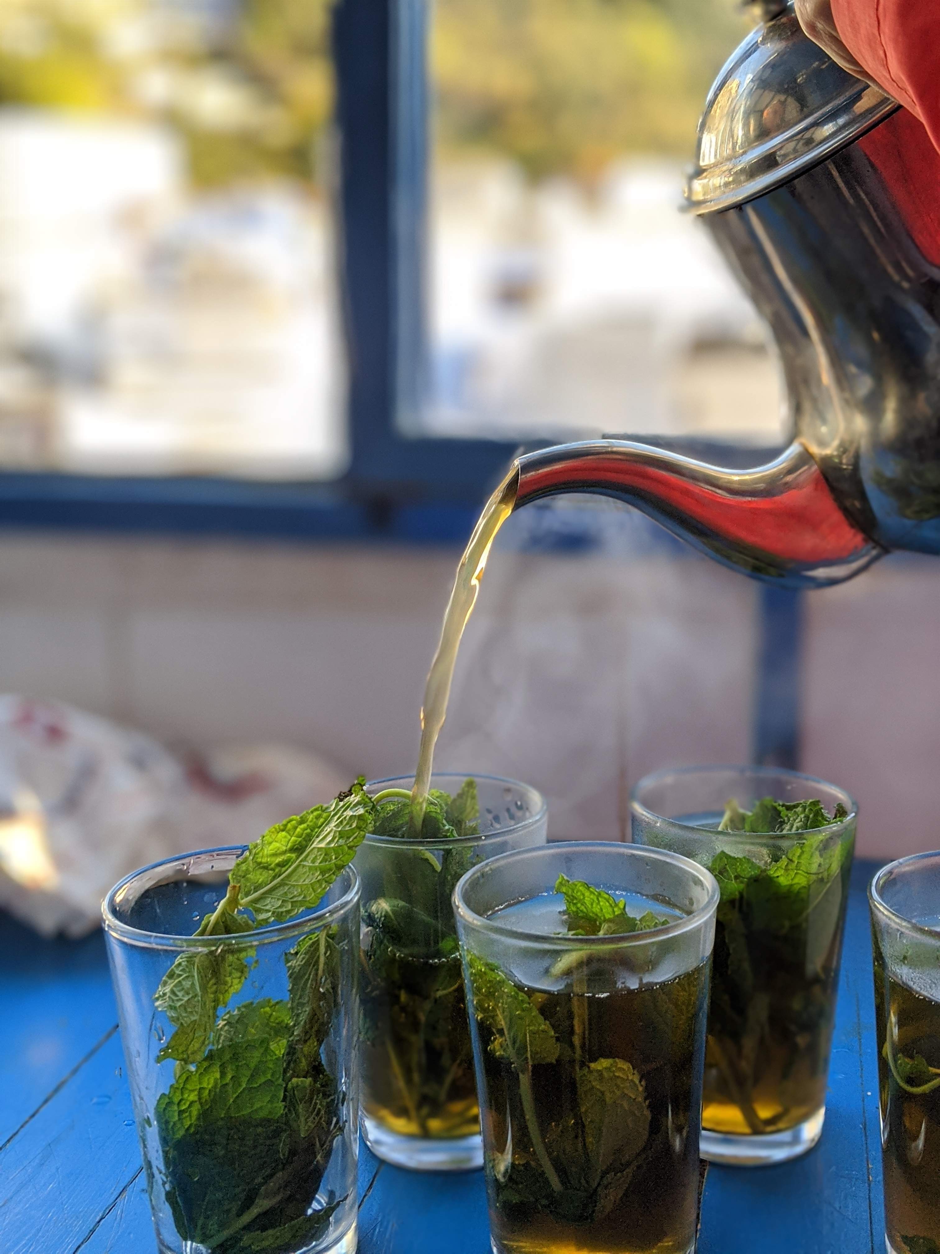 Glasses filled with mint into which tea is poured in Morocco.