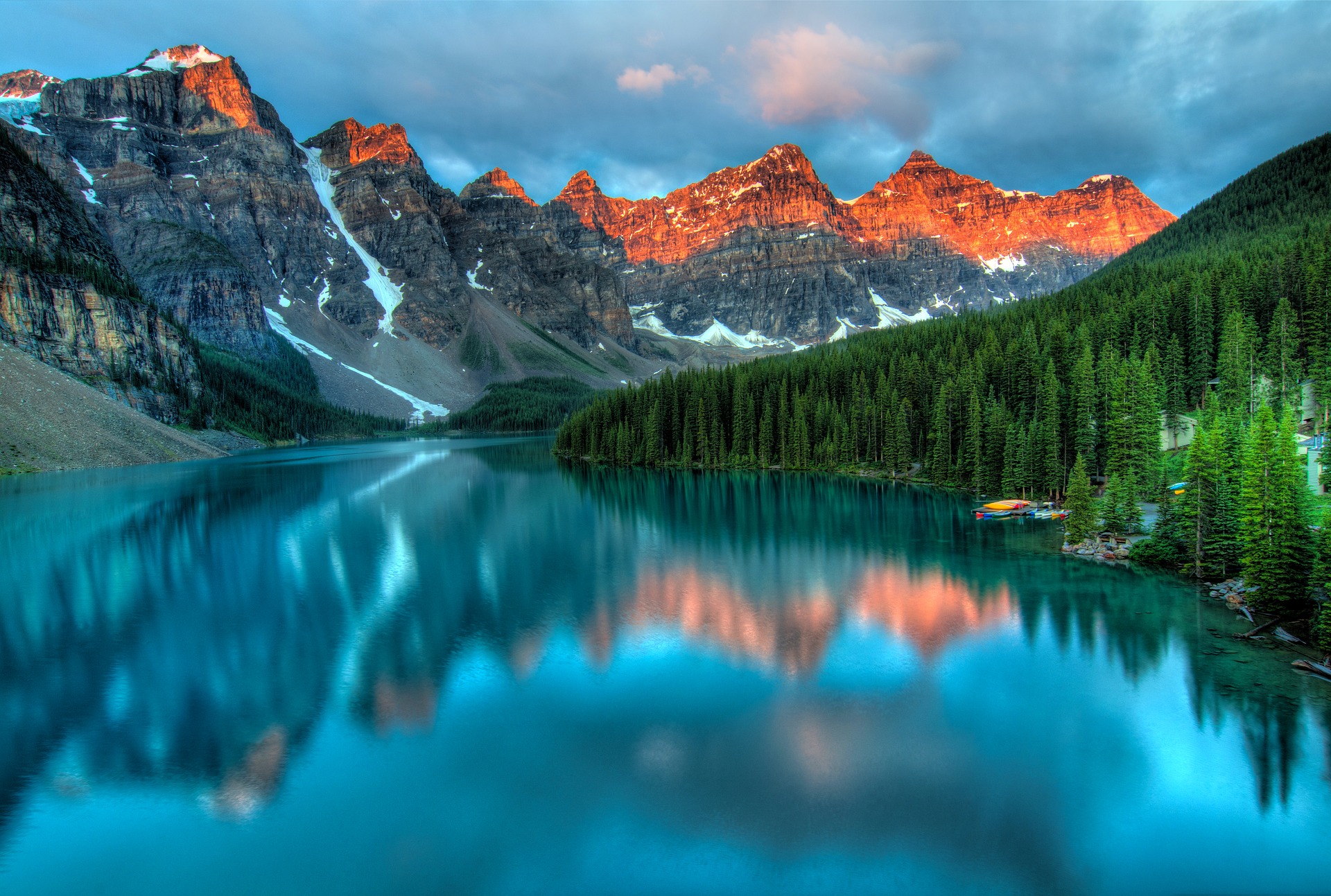 Turquoise lake in Canada with mountains and forest in the background