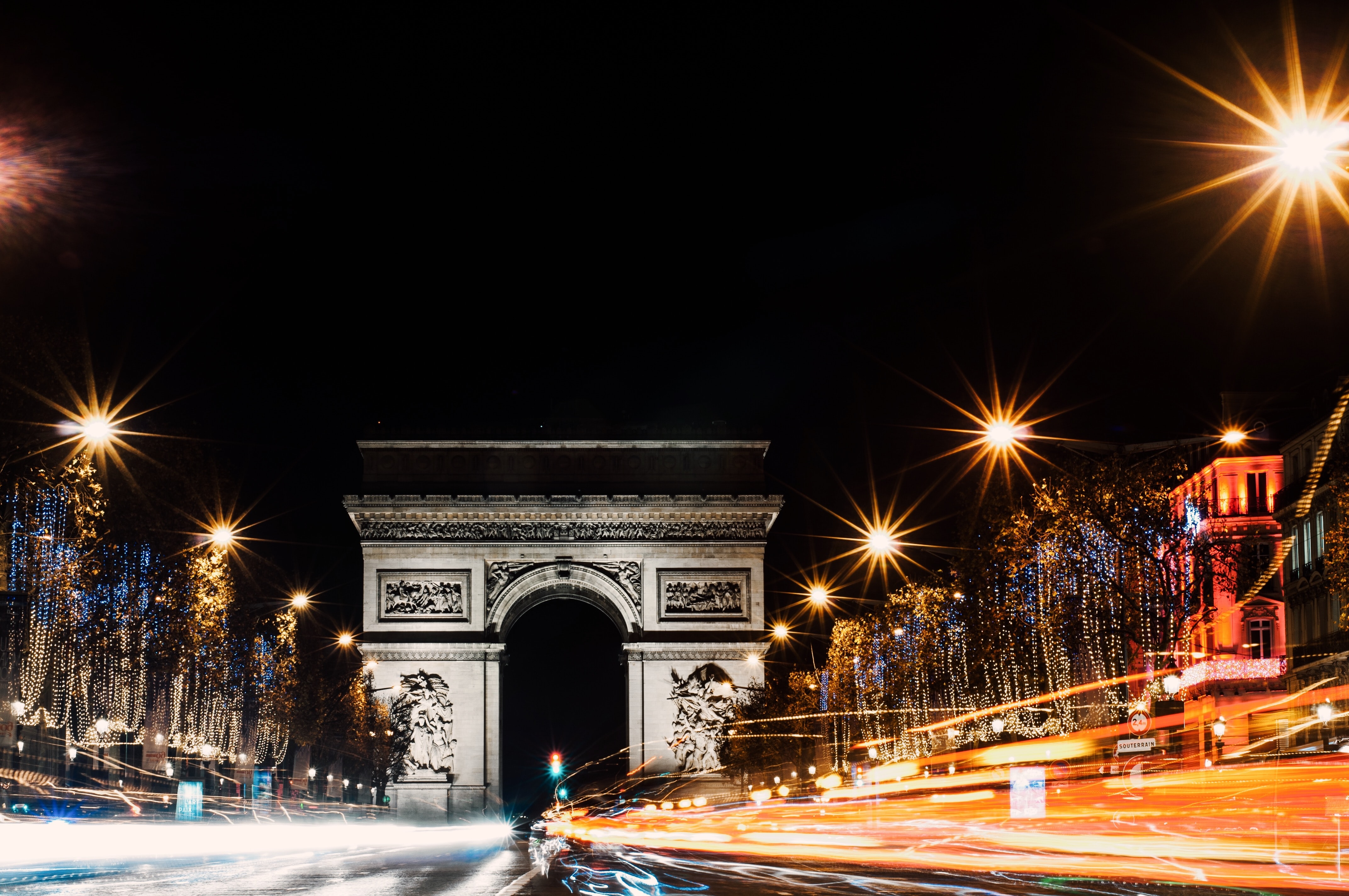 The Arc de Triomphe in Paris at night, one of the most beautiful cities in the world