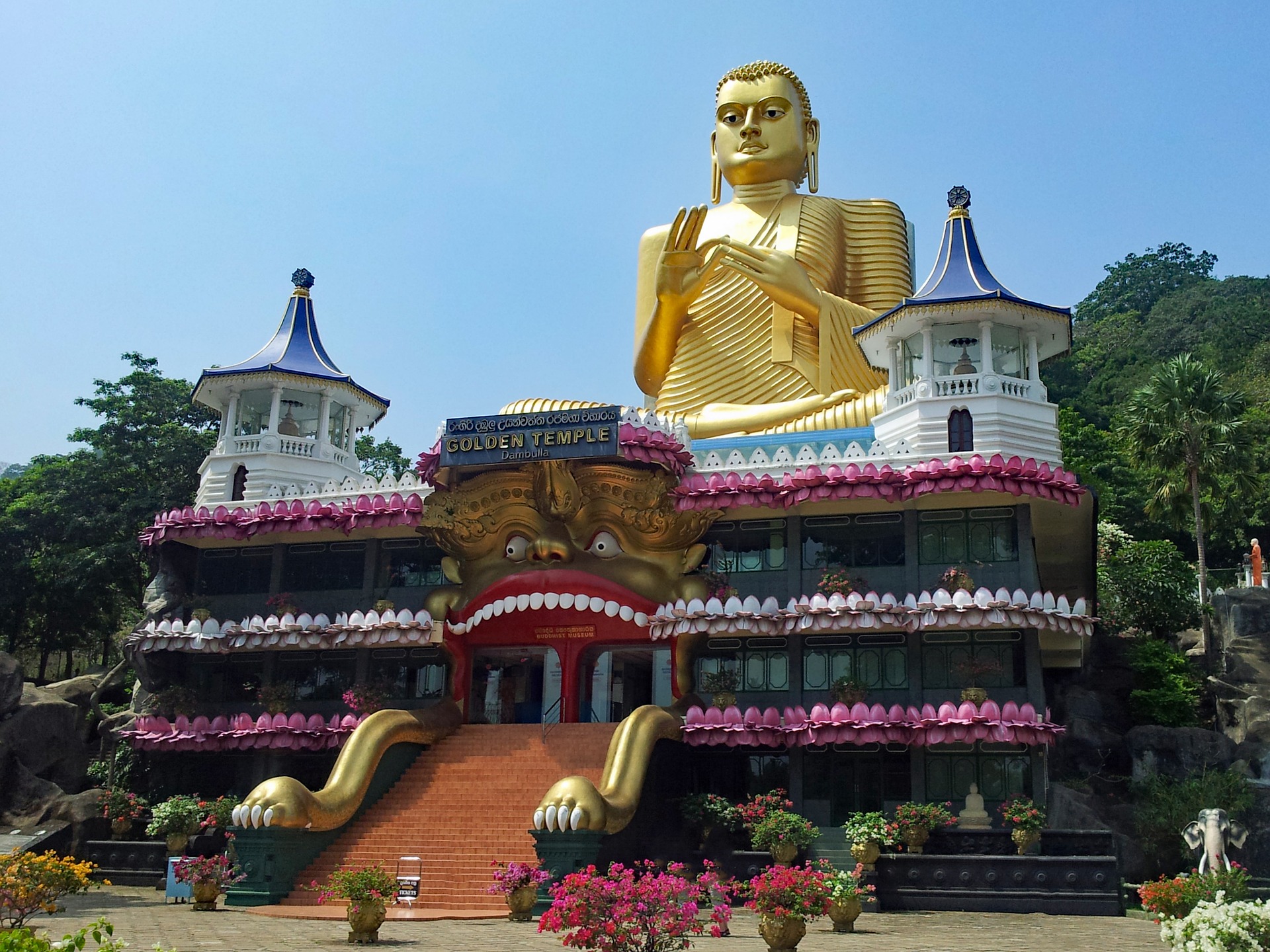 A huge golden statue of Buddha in Sigiriya, Sri Lanka.