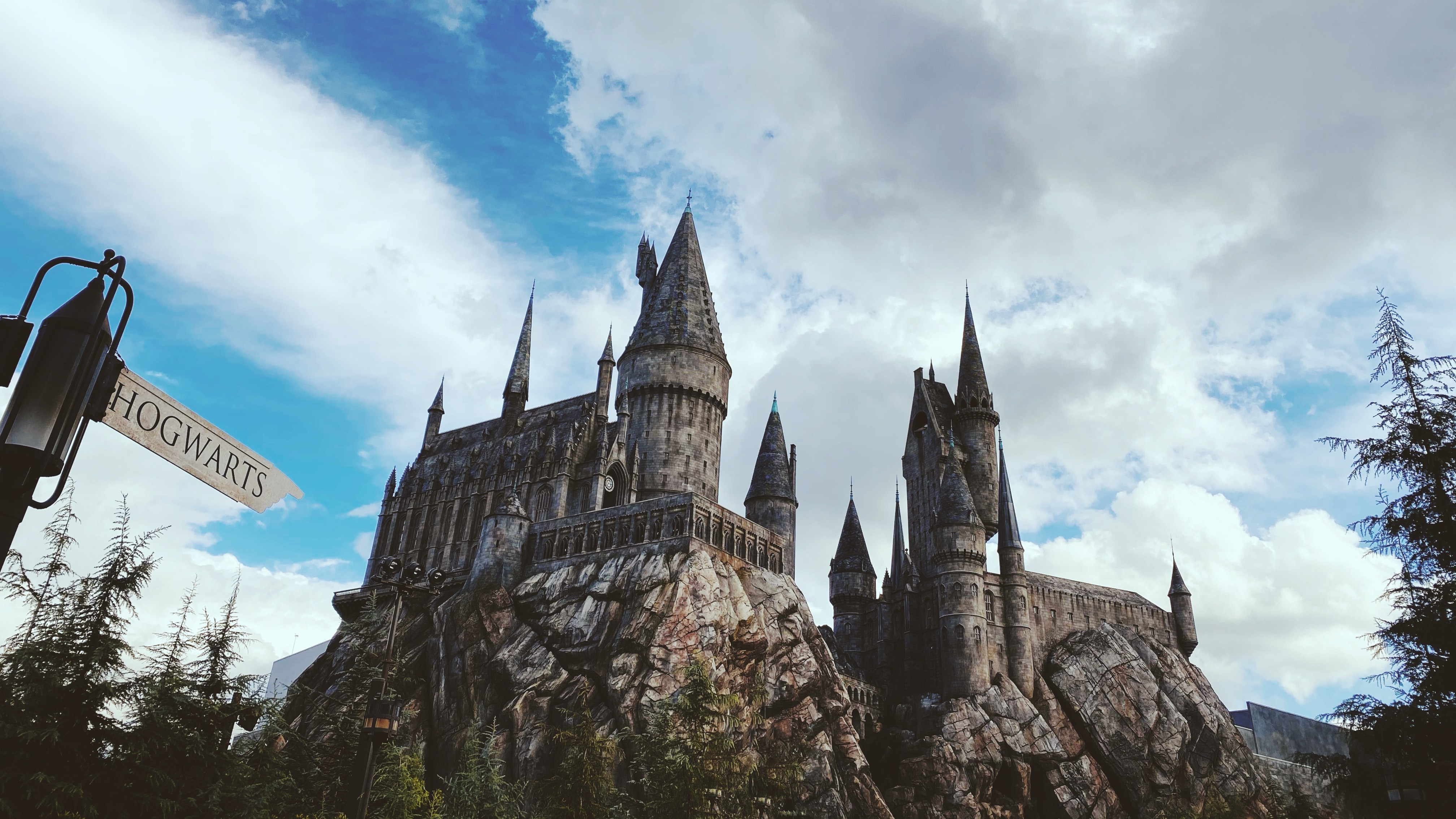 A replica of Hogwarts Castle on a mountain at Universal's Island of Adventure theme park.